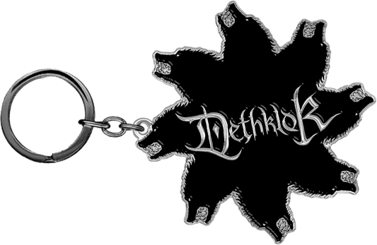 Small black enamel Dethklok keychain featuring the Wolves Star design with sharp lines and metallic detailing on a keyring.